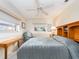 Comfortable bedroom with ample natural light, ceiling fan, and cozy furnishings for a relaxing retreat at 5533 97Th N Way, St Petersburg, FL 33708