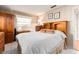 Well-lit bedroom with wood accents, closet access, and warm decor for a relaxing atmosphere at 5533 97Th N Way, St Petersburg, FL 33708