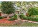 Charming home with brick accents, stone walkway and well-maintained landscaping adding to its inviting appeal at 5533 97Th N Way, St Petersburg, FL 33708