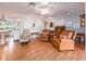 Comfortable living room with wood floors, leather armchairs, and lots of natural light at 5533 97Th N Way, St Petersburg, FL 33708