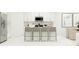 Contemporary kitchen with a stainless steel fridge, modern microwave, and a large island with seating at 5628 Red Kite Dr, Wimauma, FL 33598