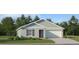 Charming single-story home featuring a two-car garage, landscaped yard, and inviting front entrance at 5675 Yellow Hornbill Ave, Wimauma, FL 33598