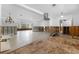 Open-concept living area with light tile floors and large windows, awaiting renovation at 636 Tarawitt Dr, Longboat Key, FL 34228