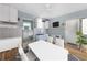 Living room features a bright table and chairs plus kitchen cabinets and an open floorplan at 636 Tarawitt Dr, Longboat Key, FL 34228