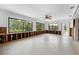 Large living room with tiled floor and large picture windows at 636 Tarawitt Dr, Longboat Key, FL 34228