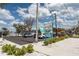 La Key Island Grille exterior featuring a vibrant sign, lush landscaping, and ample parking on a sunny day at 636 Tarawitt Dr, Longboat Key, FL 34228