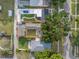 Aerial view of the property outlined in red, highlighting the layout, landscaping, and surrounding neighborhood at 712 43Rd N Ave, St Petersburg, FL 33703