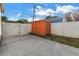 Backyard featuring a storage shed and a gated area with a concrete floor at 712 43Rd N Ave, St Petersburg, FL 33703