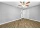 Spacious bedroom with wood-look floors, neutral paint, and closet at 712 43Rd N Ave, St Petersburg, FL 33703