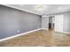 Spacious bedroom featuring wood-look tile flooring, recessed lighting, and modern ceiling light at 712 43Rd N Ave, St Petersburg, FL 33703
