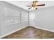 Bright bedroom features new flooring, ample windows and a door for access to outdoors at 712 43Rd N Ave, St Petersburg, FL 33703
