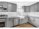 Modern kitchen with stainless steel appliances, farmhouse sink, and granite countertops at 712 43Rd N Ave, St Petersburg, FL 33703