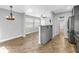 Open-concept living space features views to kitchen, dining, and ample windows at 712 43Rd N Ave, St Petersburg, FL 33703