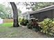 A home's backyard with screen porch at 1001 Brookside Dr, Clearwater, FL 33764