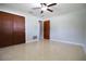 Spacious bedroom with a ceiling fan and double door closet at 1001 Brookside Dr, Clearwater, FL 33764
