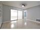 Bright living space featuring sliding glass doors, built-in shelving, and neutral paint at 1001 Brookside Dr, Clearwater, FL 33764