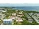 Expansive aerial view highlighting building's proximity to the water and a bridge in the distance at 1012 Pearce Dr # 304, Clearwater, FL 33764