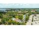 Beautiful landscaping and mature trees surround the community pool in this aerial view at 1012 Pearce Dr # 304, Clearwater, FL 33764