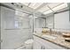 Bright bathroom featuring a large glass shower, granite countertop, and recessed lighting at 1012 Pearce Dr # 304, Clearwater, FL 33764