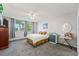 Bright bedroom featuring neutral walls, plush gray carpet, and an inviting window view at 1012 Pearce Dr # 304, Clearwater, FL 33764