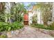 Beautiful condo exterior featuring lush landscaping and a welcoming entrance at 1012 Pearce Dr # 304, Clearwater, FL 33764