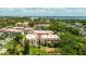 Charming condo building surrounded by well-maintained landscaping with mature tree coverage at 1012 Pearce Dr # 304, Clearwater, FL 33764