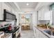 Bright eat-in kitchen with stainless appliances, white cabinetry, and granite countertops at 1012 Pearce Dr # 304, Clearwater, FL 33764