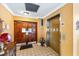 Building lobby featuring secure wooden doors and an elevator at 1012 Pearce Dr # 304, Clearwater, FL 33764