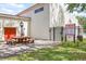 Community pool area featuring a picnic table and gated access with posted pool rules at 1012 Pearce Dr # 304, Clearwater, FL 33764