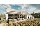 Outdoor kitchen and entertaining space with a modern grill, seating, and views of the community garden at 10242 Gentle Rain Dr, Land O Lakes, FL 34638