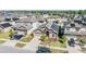 Aerial view of a residential neighborhood highlighting solar panels on the roof at 11922 Winterset Cove Dr, Riverview, FL 33579