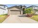 Beautiful single-Gathering home featuring a two-car garage, well-maintained landscaping, and a spacious driveway at 11922 Winterset Cove Dr, Riverview, FL 33579