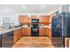 Kitchen features matching appliances and wood floors at 11922 Winterset Cove Dr, Riverview, FL 33579