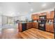 Open kitchen with a view of the living area, featuring wood floors at 11922 Winterset Cove Dr, Riverview, FL 33579