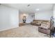 Spacious living room with neutral carpet and a comfortable reclining sofa at 11922 Winterset Cove Dr, Riverview, FL 33579