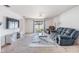 Inviting living room with plush carpet, comfortable seating, and a sliding glass door offering backyard views at 11922 Winterset Cove Dr, Riverview, FL 33579