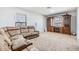 Comfortable living room featuring plush seating and a built-in entertainment center at 11922 Winterset Cove Dr, Riverview, FL 33579