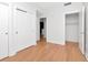 Bright bedroom featuring hardwood floors and a wide open doorway at 1208 E Kennedy Blvd # 1121, Tampa, FL 33602