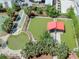 Aerial view of community amenities including green spaces, shuffleboard and a covered picnic area at 1208 E Kennedy Blvd # 1121, Tampa, FL 33602