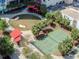 An aerial view showcases community amenities: park, tennis court, and covered picnic area at 1208 E Kennedy Blvd # 1121, Tampa, FL 33602