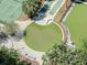 An aerial shot reveals a lush green park with a putting green and shuffleboard courts at 1208 E Kennedy Blvd # 1121, Tampa, FL 33602