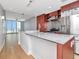 Modern kitchen with granite countertops, stainless steel appliances and island with breakfast bar at 1208 E Kennedy Blvd # 1121, Tampa, FL 33602