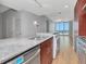 Bright, modern kitchen with stainless steel appliances, light wood floors, and expansive windows showcasing scenic views at 1208 E Kennedy Blvd # 1121, Tampa, FL 33602
