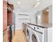 Well-lit kitchen featuring stainless steel appliances and in-unit laundry for convenience at 1208 E Kennedy Blvd # 1121, Tampa, FL 33602