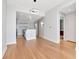 Open living space adjacent to an island kitchen, with hardwood floors and recessed lighting at 1208 E Kennedy Blvd # 1121, Tampa, FL 33602