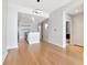 Open living space adjacent to an island kitchen, with hardwood floors and recessed lighting at 1208 E Kennedy Blvd # 1121, Tampa, FL 33602