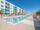 Large outdoor pool with lounge chairs and tables, perfect for relaxation at 1208 E Kennedy Blvd # 1121, Tampa, FL 33602
