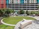 Enjoy the community putting green near lush landscaping and seating at 1208 E Kennedy Blvd # 1121, Tampa, FL 33602