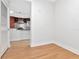 Bright room with neutral walls and flooring, showcasing an open doorway to the kitchen at 1208 E Kennedy Blvd # 1121, Tampa, FL 33602