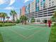 Community volleyball court surrounded by green space and palm trees at 1208 E Kennedy Blvd # 1121, Tampa, FL 33602